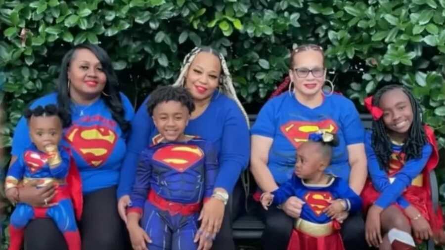 family in super hero costumes to represent their hero