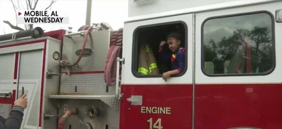 little boy in fire truck