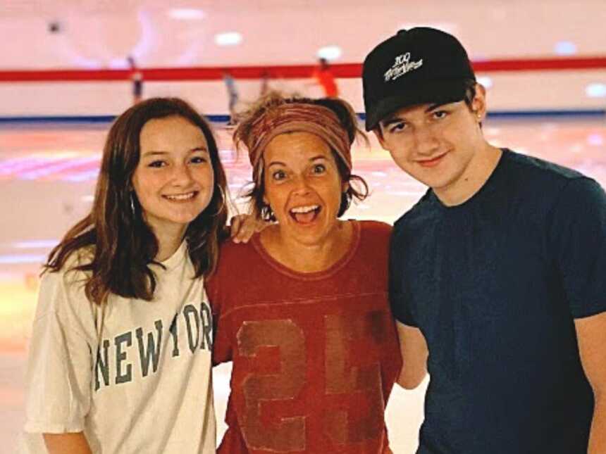 A mom with her two teenagers at a skating rink