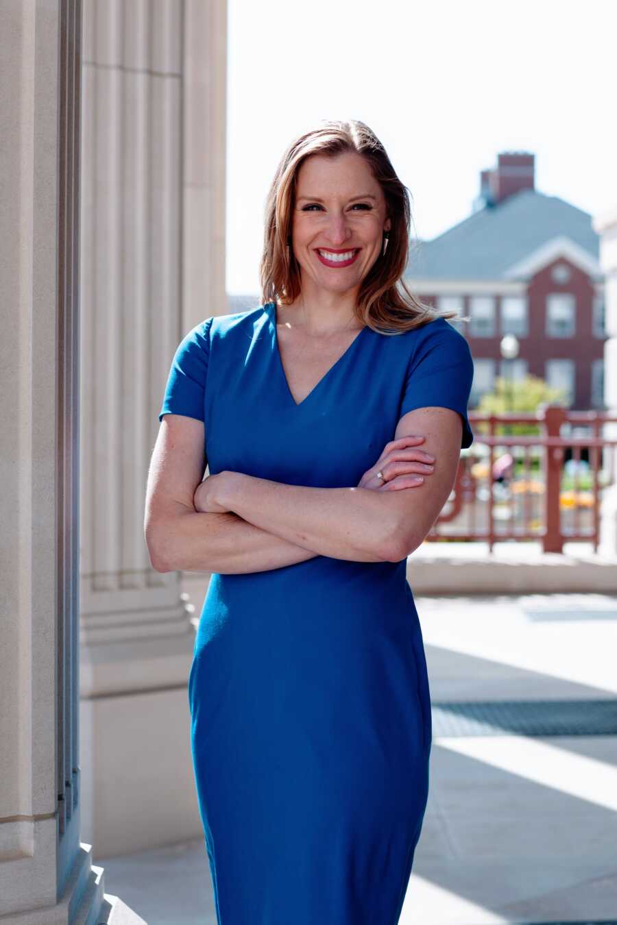 woman poses for professional photos for her law career