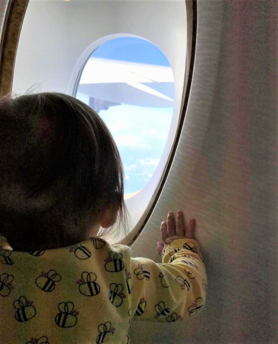little girl looking out the window