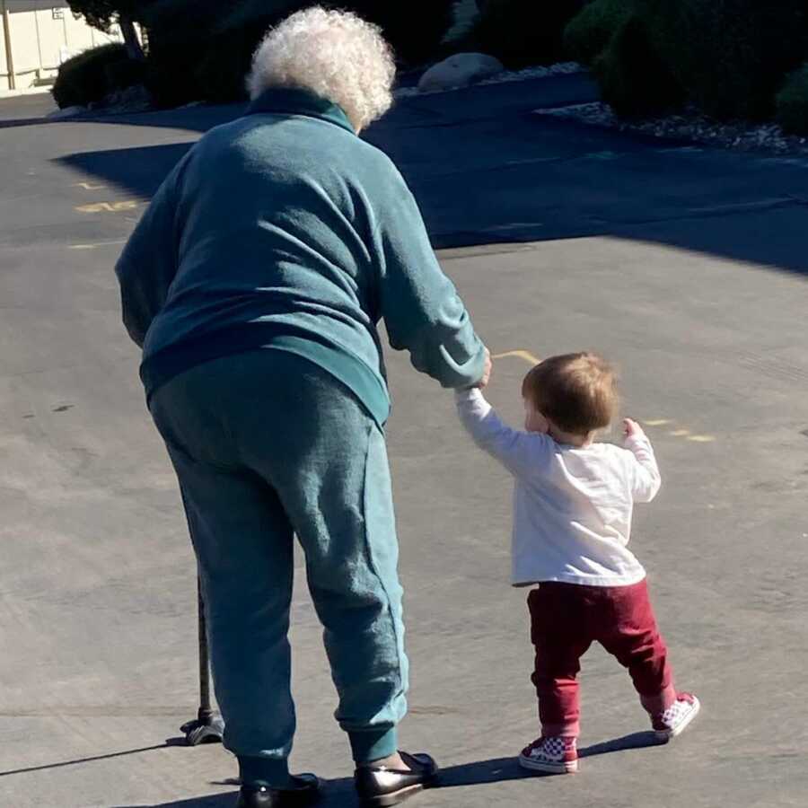 great grandma walking with her great grandkid