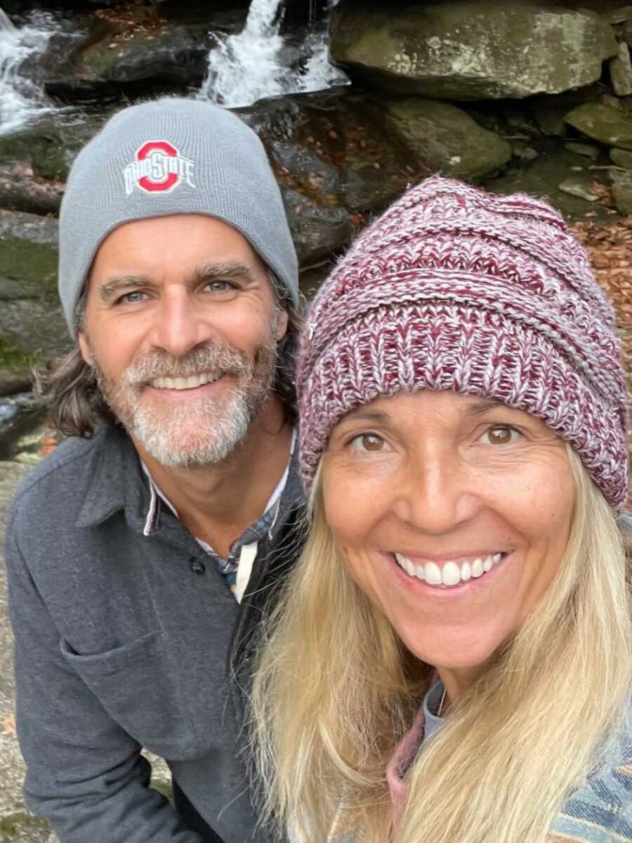 woman and her husband taking a selfie on a hike