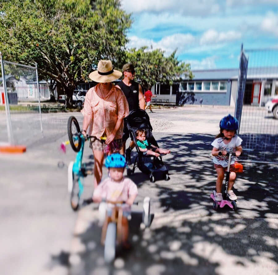 mom with her kids going on a bike ride