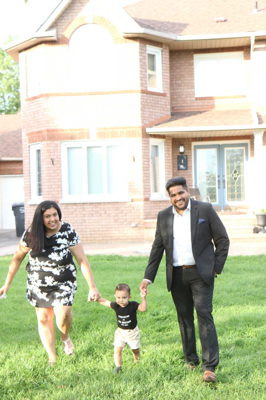 mom dad and brother in the grass