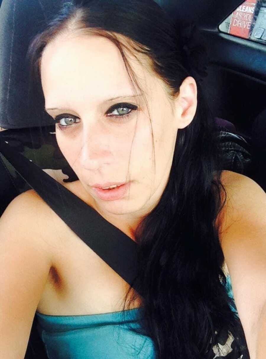 woman recovering taking a selfie in her car