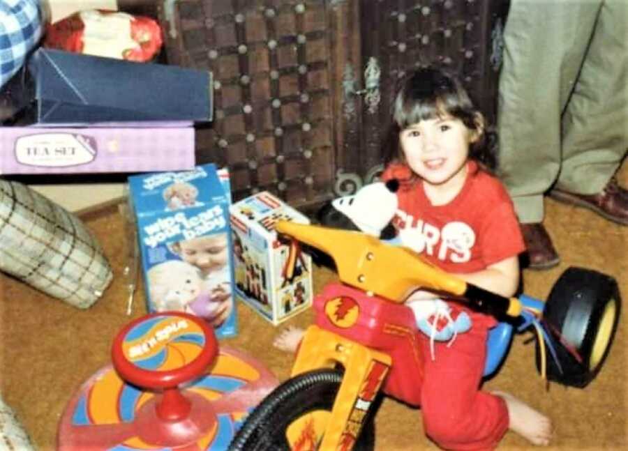 Asian American toddler girl playing with toys 