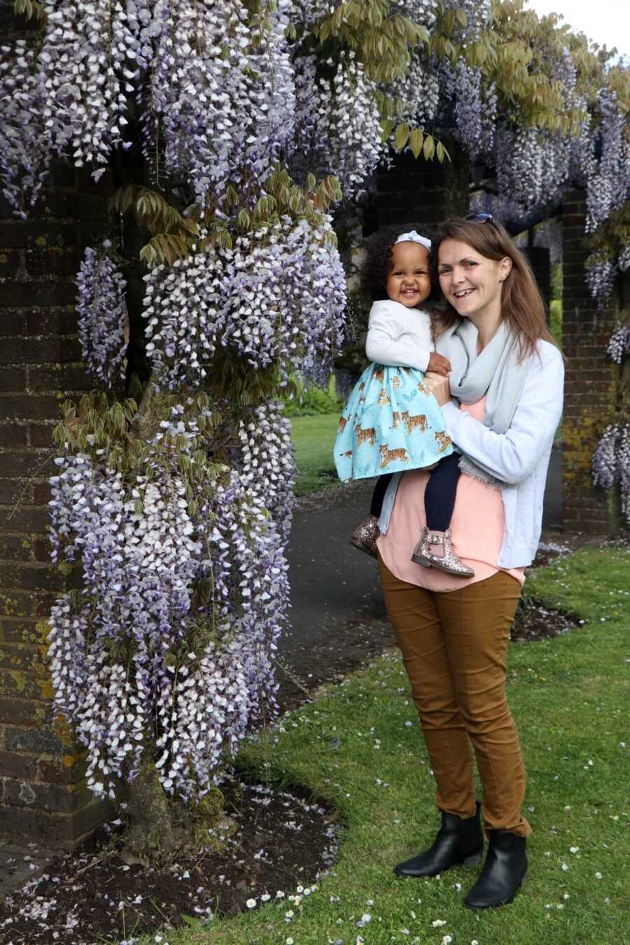 woman holding her daughter