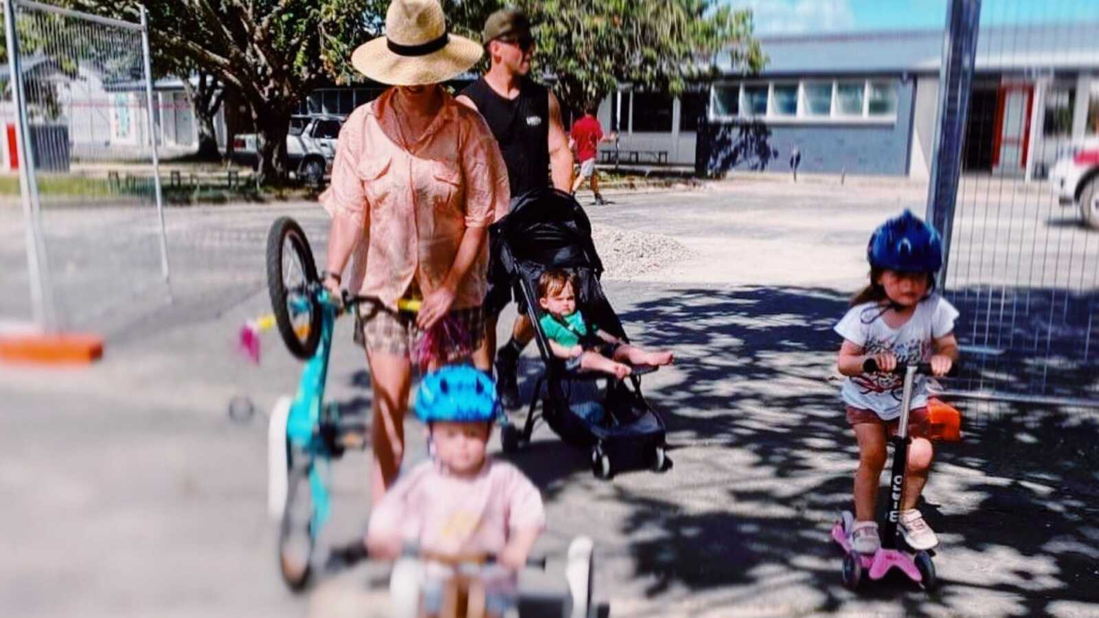 mom with her kids going on a bike ride