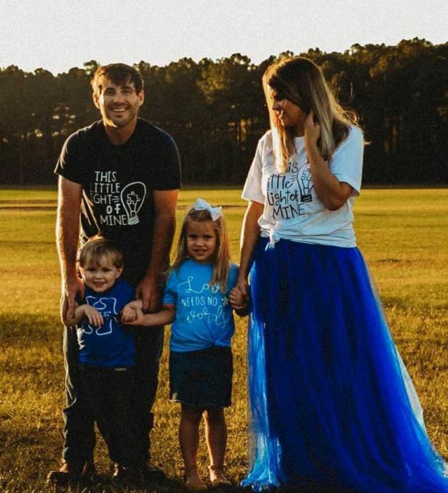 Family of four take photos together in matching t-shirts to raise awareness about autism