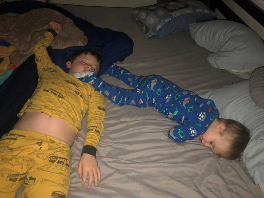two boys in their pjs sleeping