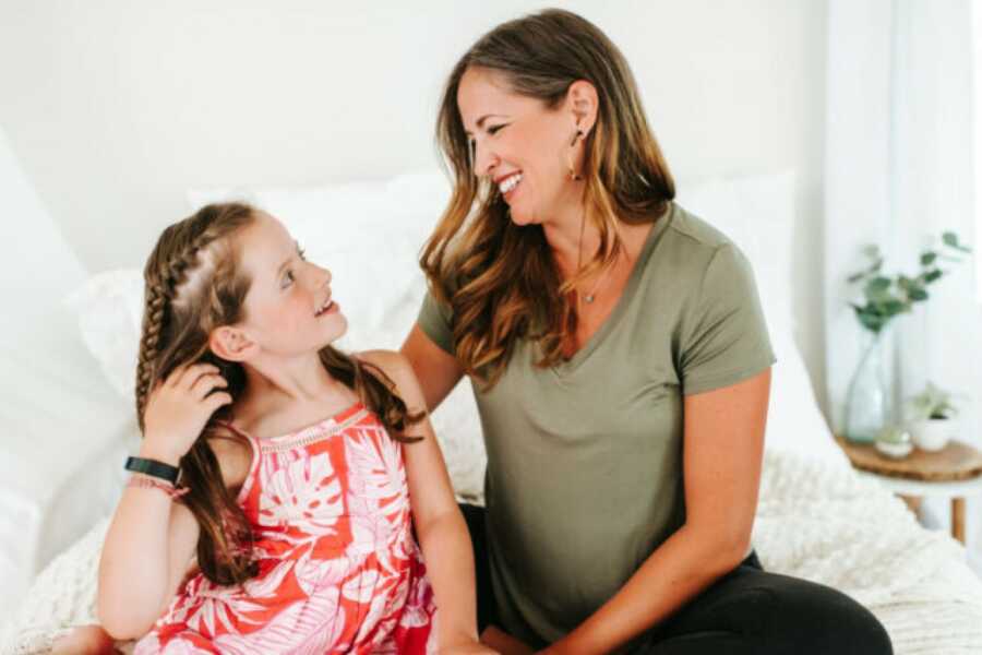 mom and daughter looking at each other while talking