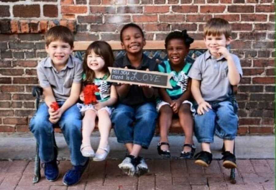 children with a beautiful sign