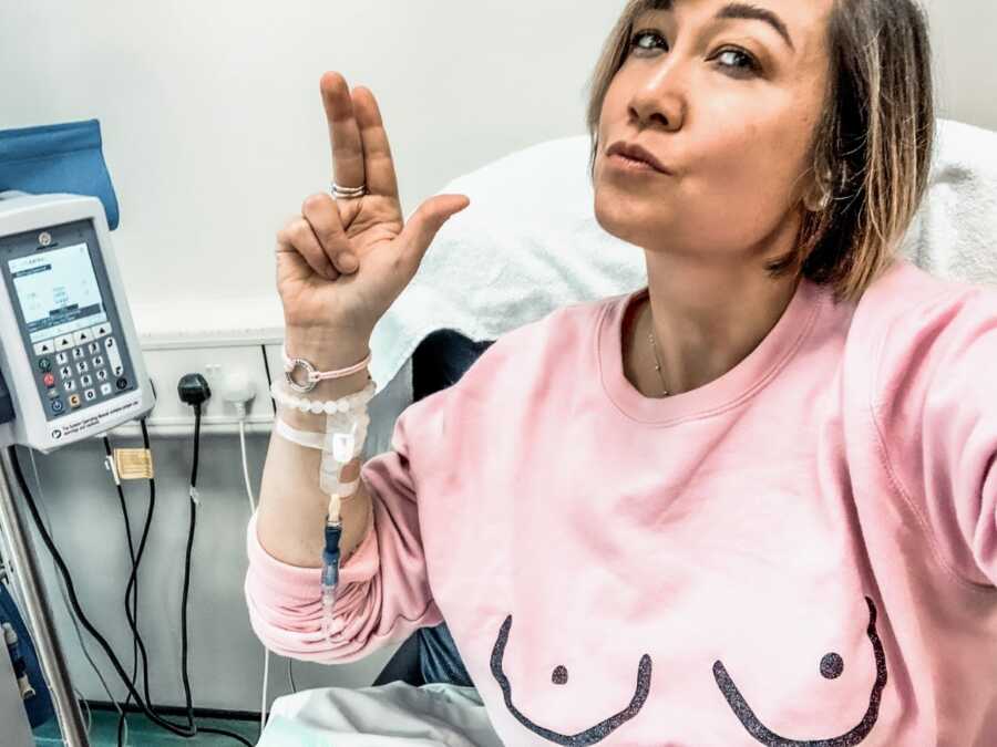 Woman takes brave selfie while in the hospital for treatment for her breast cancer