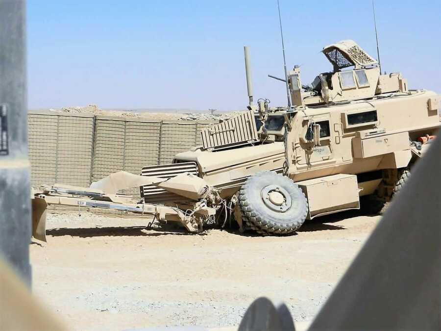 wrecked military tank after being hit by explosives