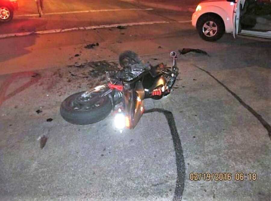 wrecked motorcycle after near fatal traffic accident