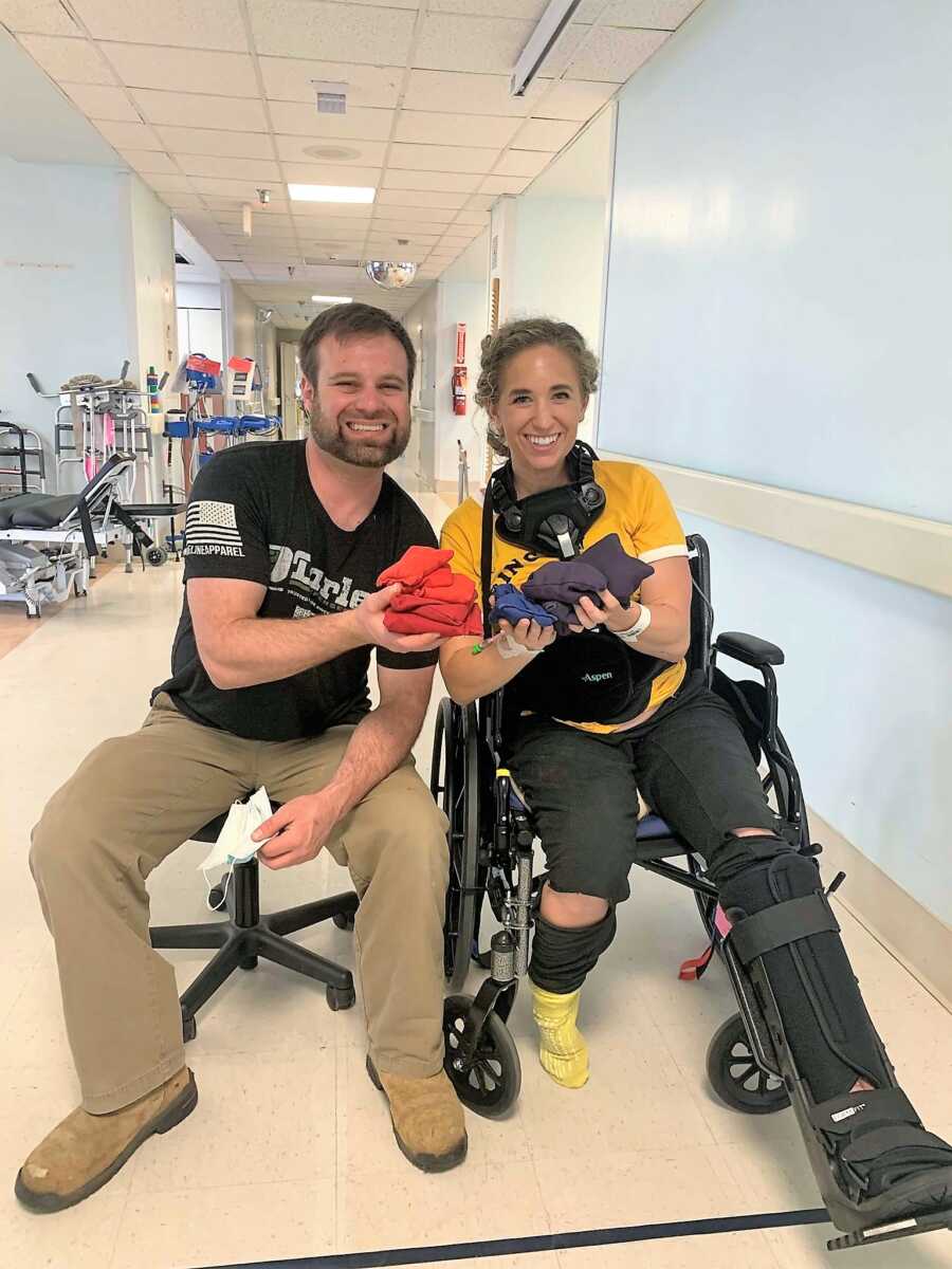Woman recovering from skydiving accident sitting on a wheelchair at the hospital next to her brother