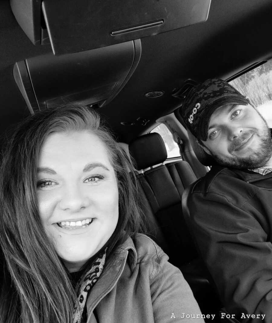 wife and husband taking a car selfie