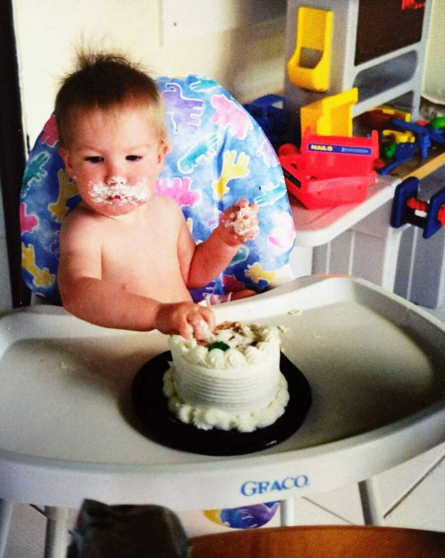 baby girl eating cake