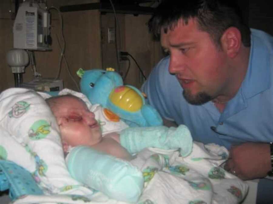 dad admiring his new born son