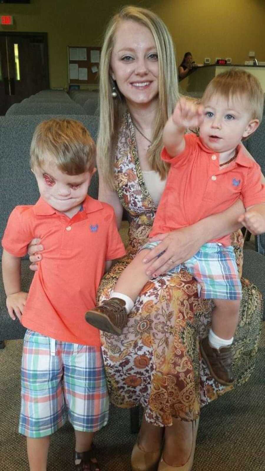 mom taking picture with both sons