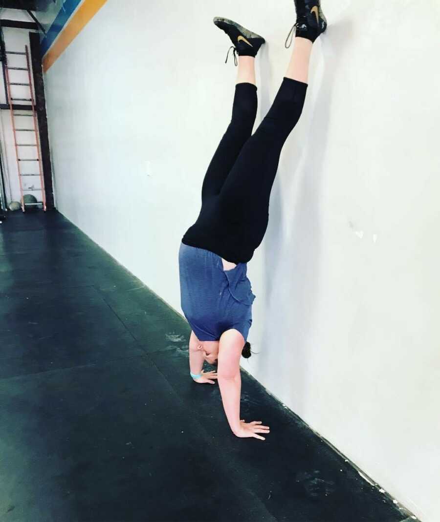 woman doing handstand