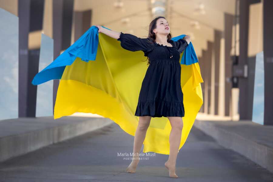 woman with ukraine colors dancing