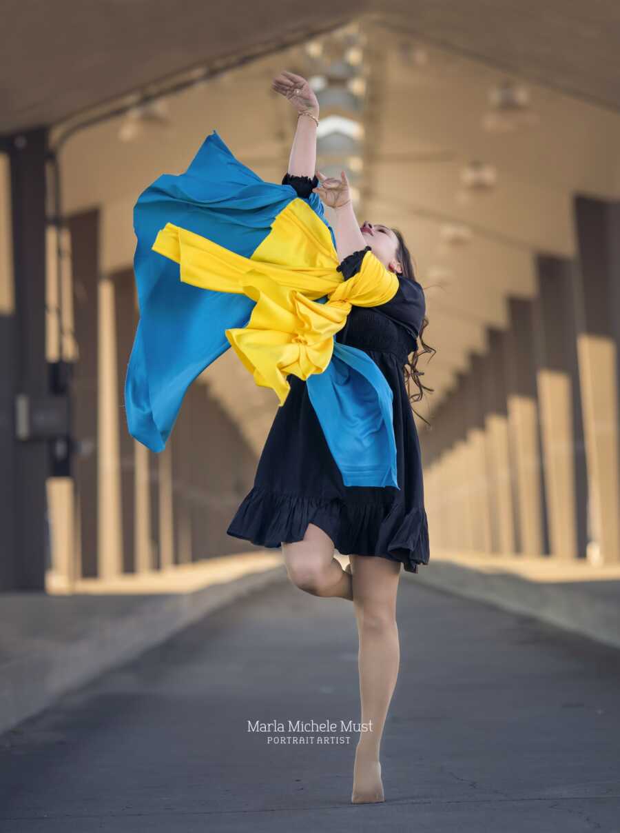 woman showing ukraine colors
