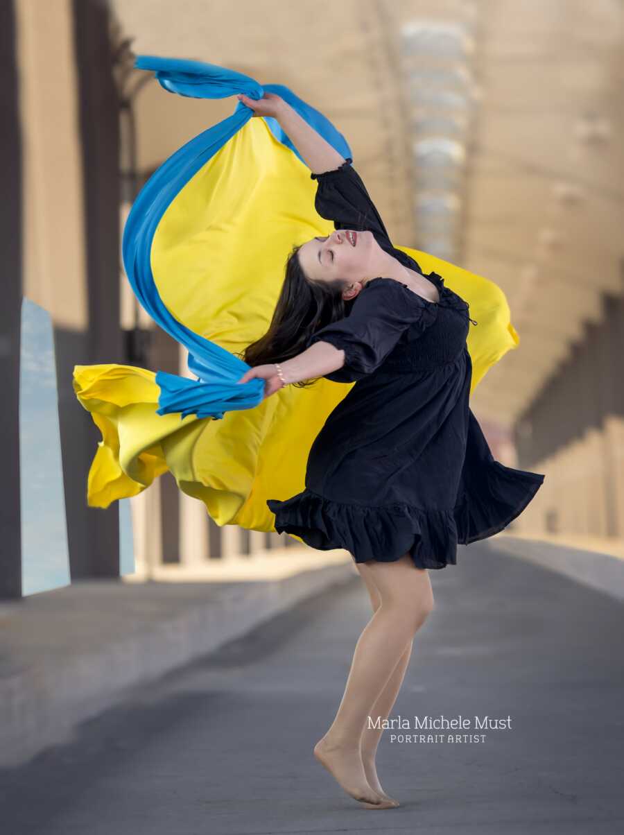 woman with ukraine colors showing them off