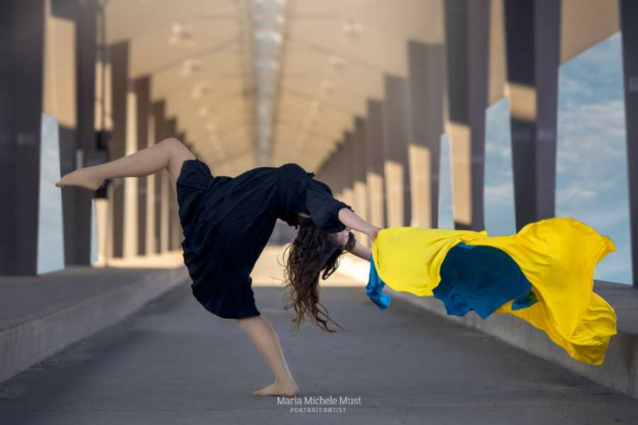 woman with ukraine colors bending backwards