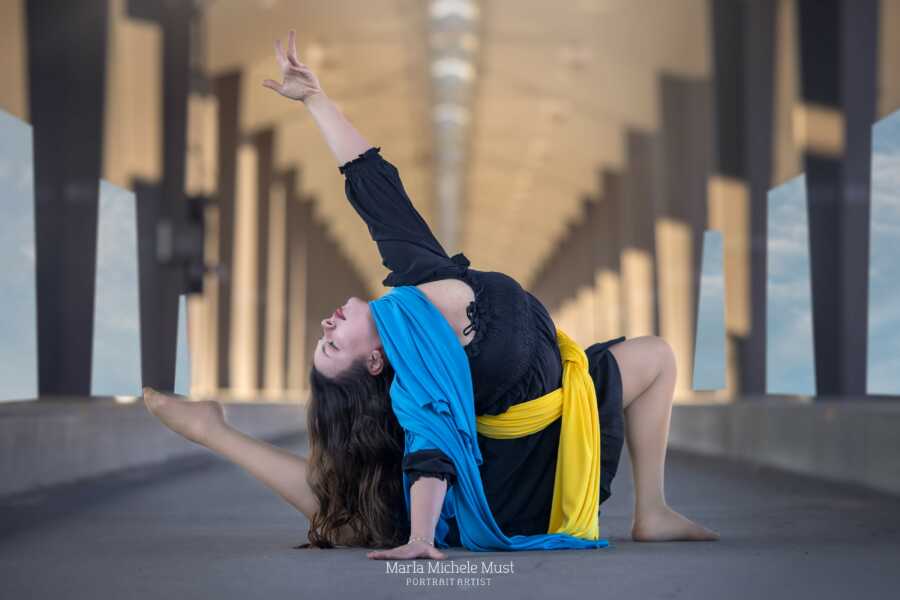 woman with ukraine colors on the ground