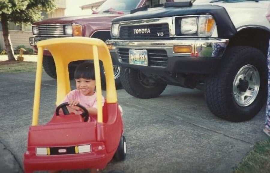 baby boy playing in a car