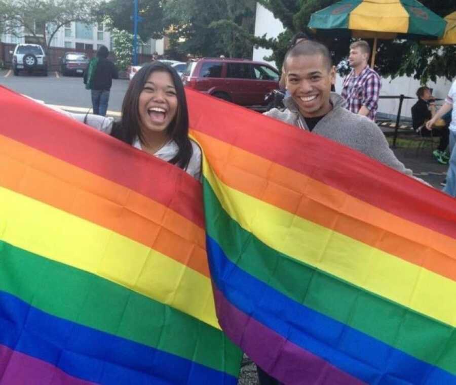 sister with her brother and pride flags