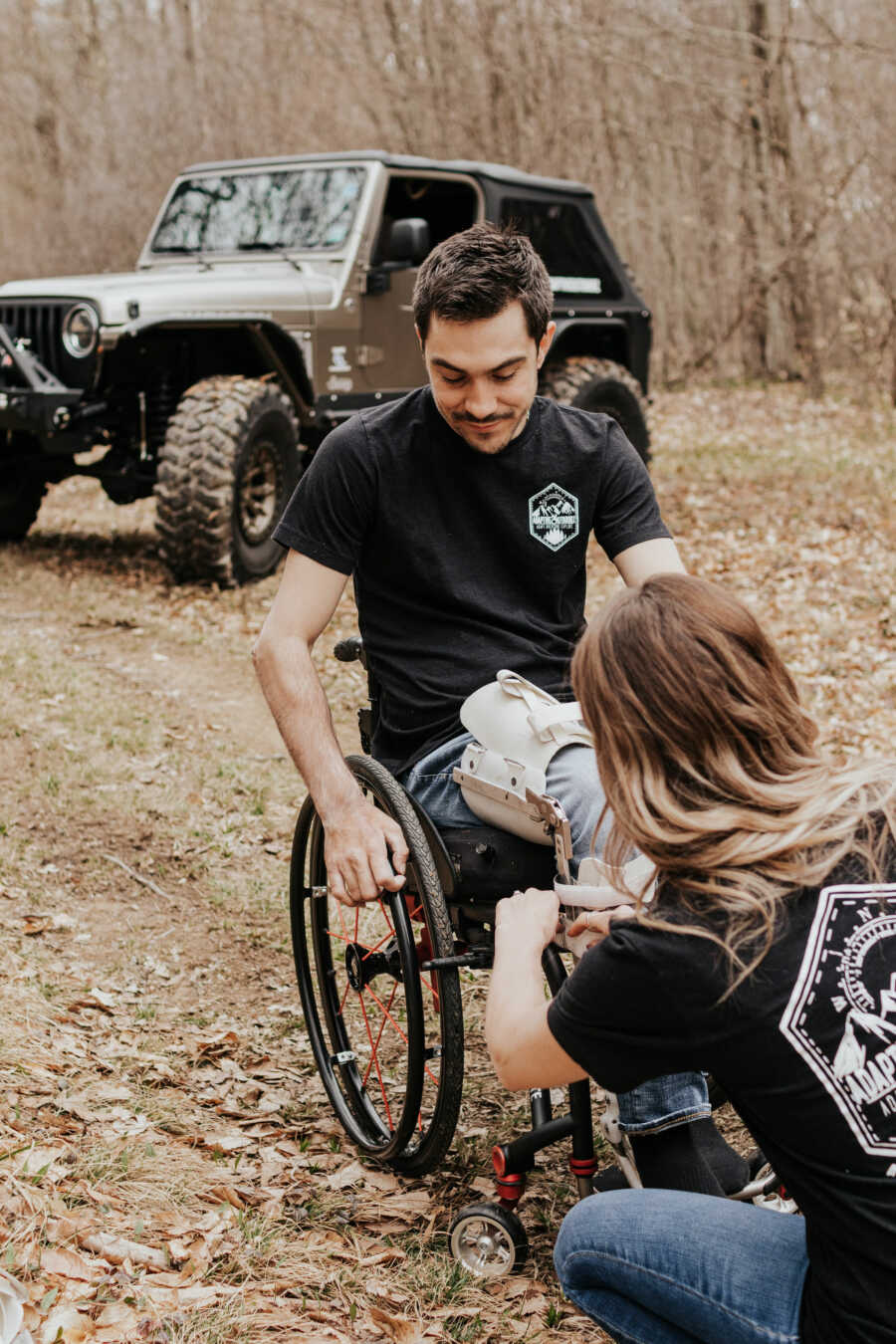 man in a wheel chair with his partner