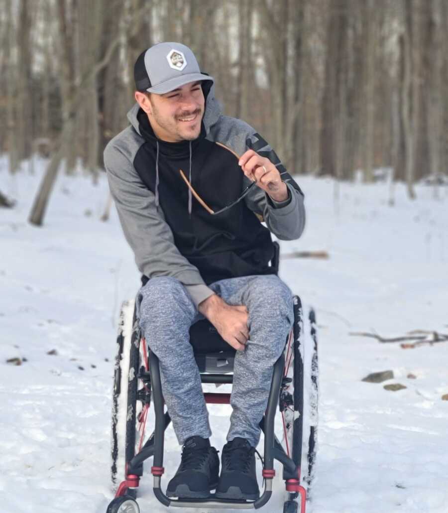 man in wheel chair in the snow