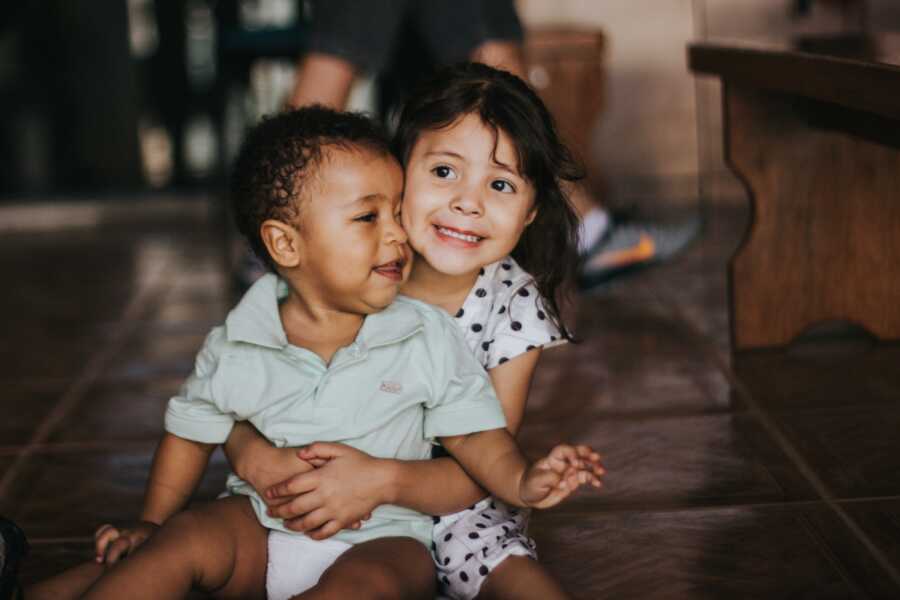 siblings hugging each other