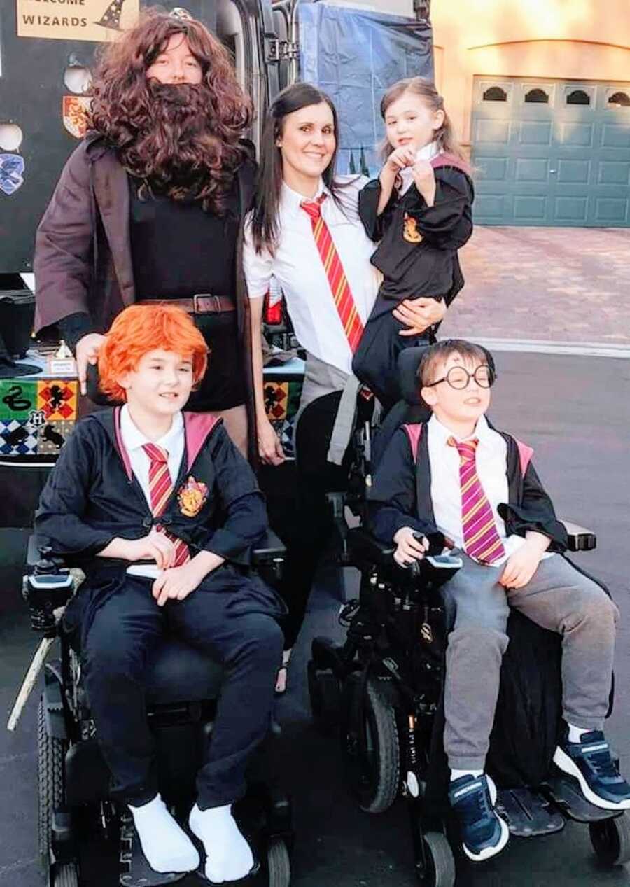 Family dressed in Harry Potter costumes poses together, two sons with Duchenne's and a daughter with parents