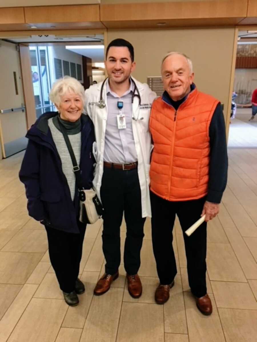 Man in his residency for cardiology takes a photo with his grandparents