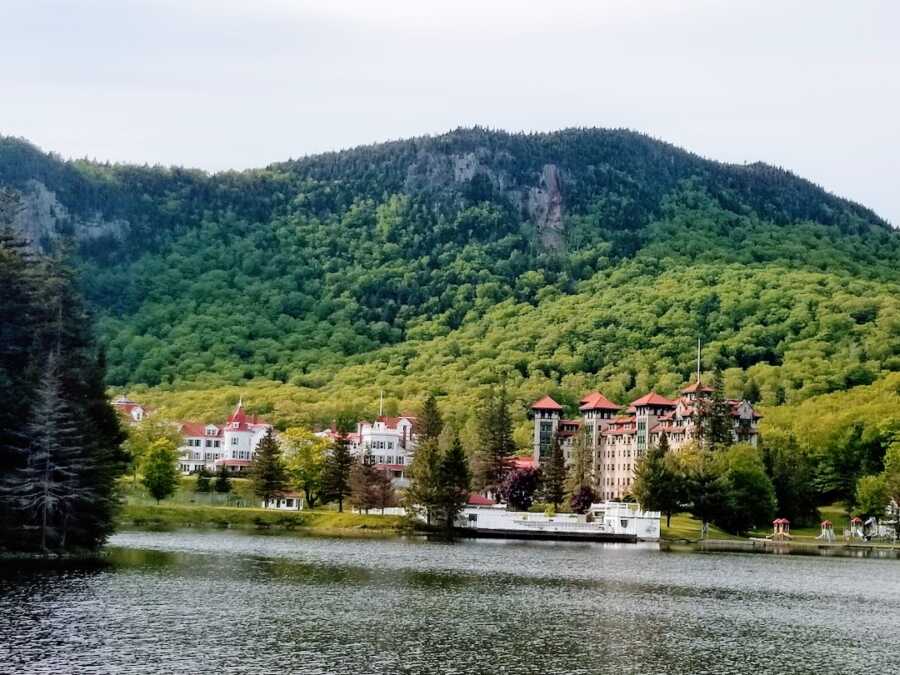 across the water at The Balsams hotel with the scenery in the background