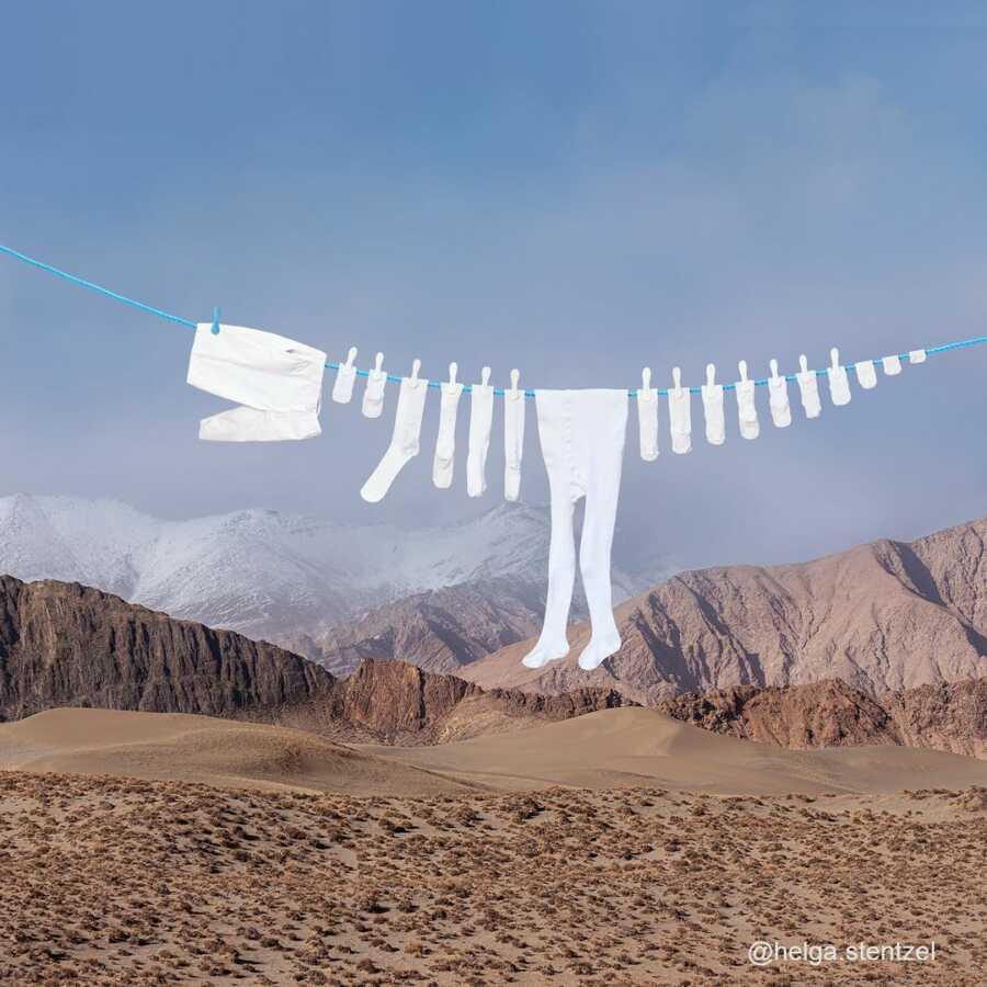 clothesline with socks and other clothing items positioned to look like a dinosaur skeleton