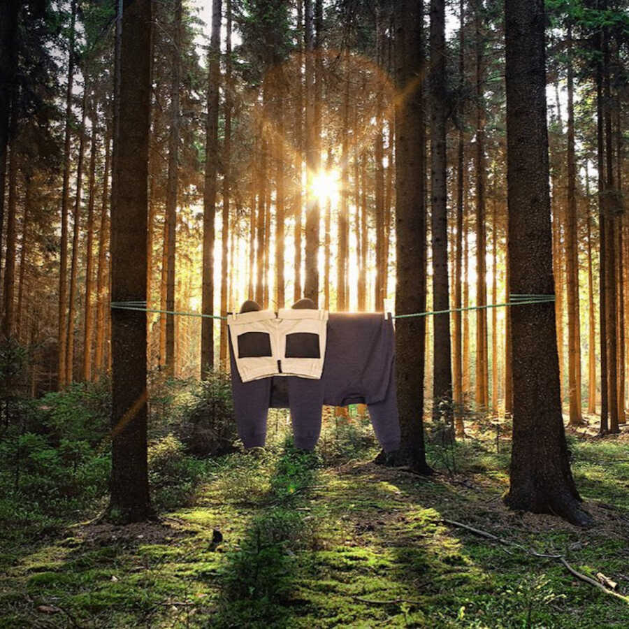 clothes hung on clothesline to look like a panda in the middle of the forrest