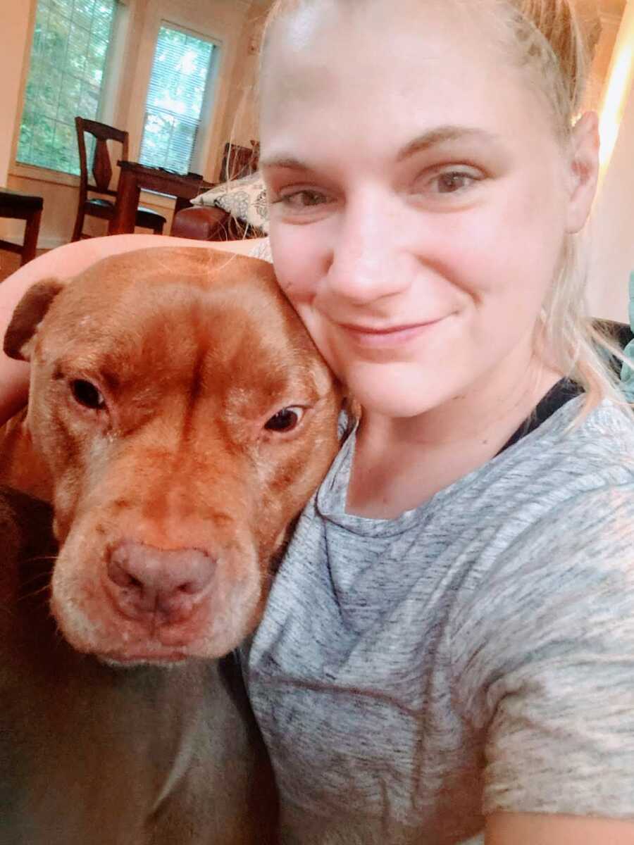 dog mom takes a selfie with her loyal dog