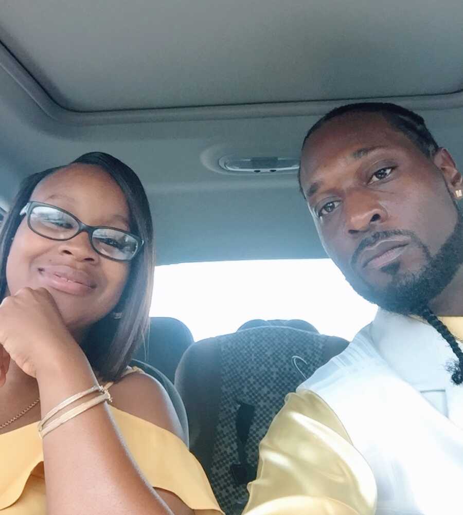 husband and wife take a selfie together in the car