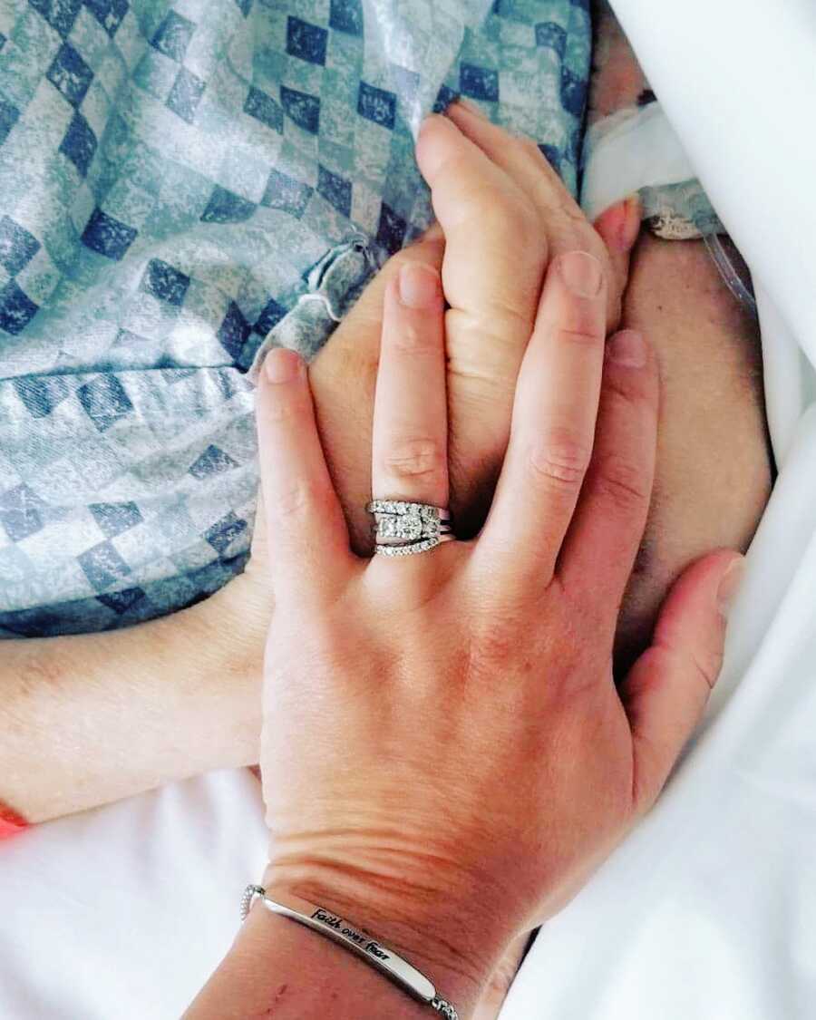 hands of adopted daughter and biological mother the day they reunited
