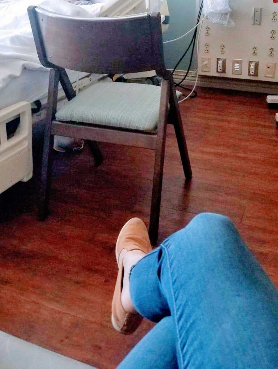 woman waits by her birth mothers bed side while she is in hospice care