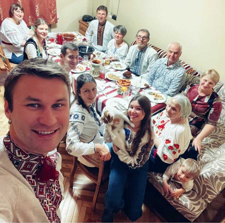 Ukrainian family having dinner with their granny.