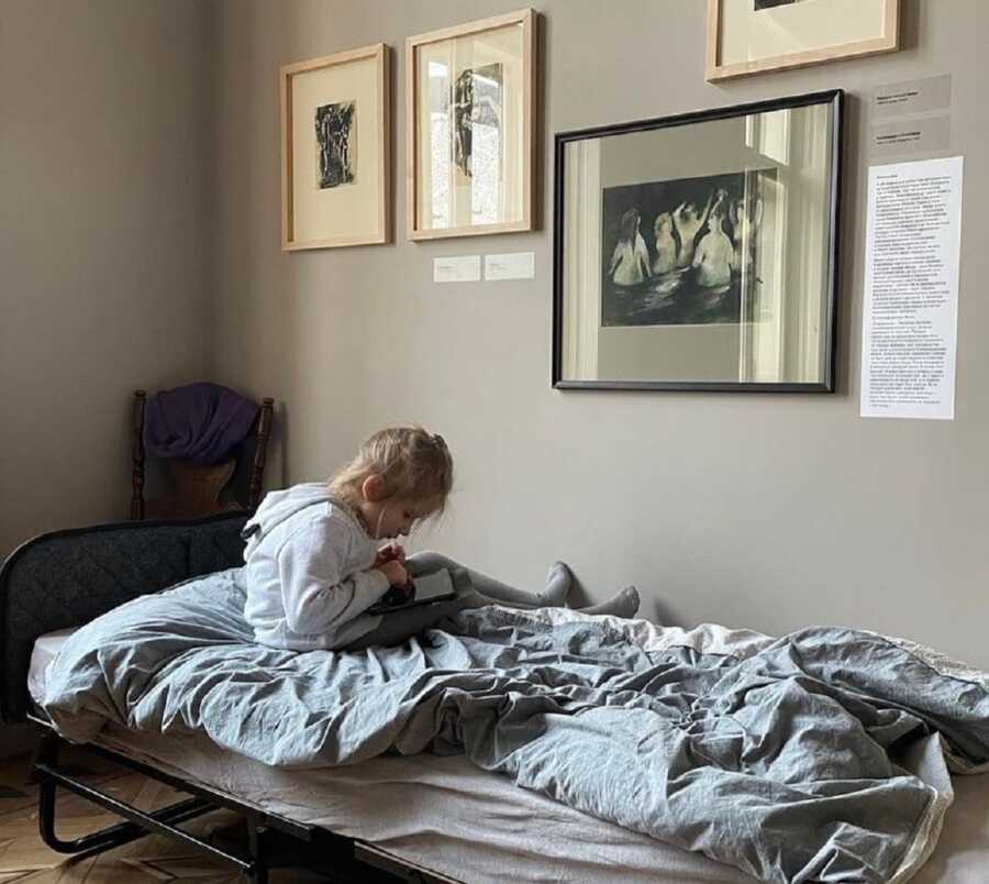 Young Ukrainian girl takes refuge in art gallery in Lviv.