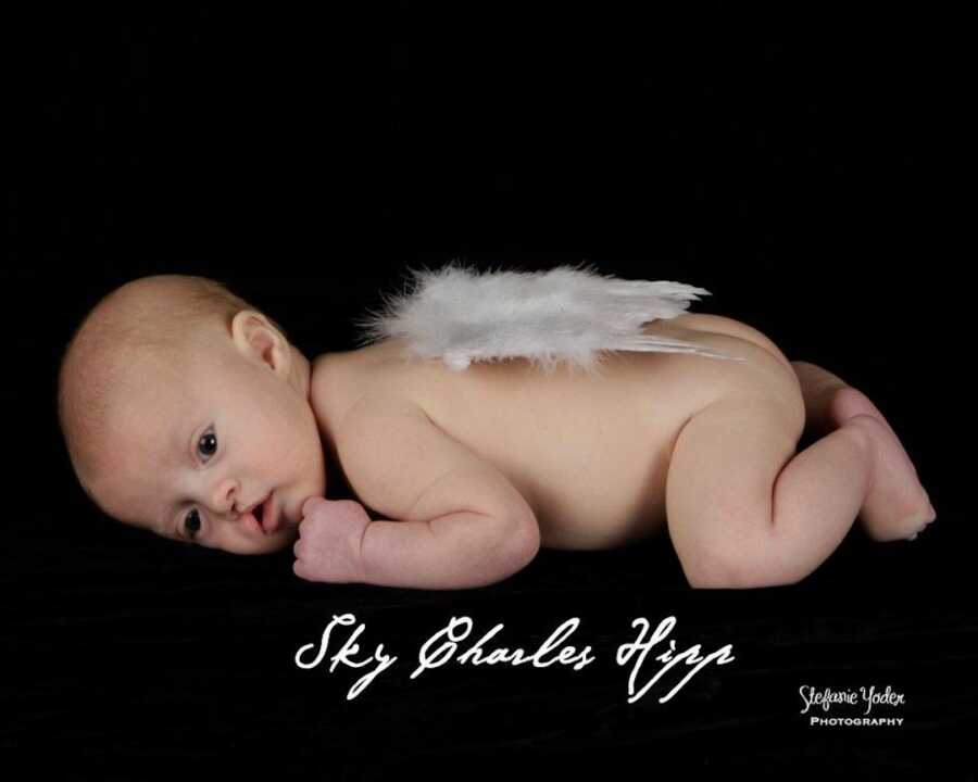 baby photo of baby boy with angel wings edited onto the back