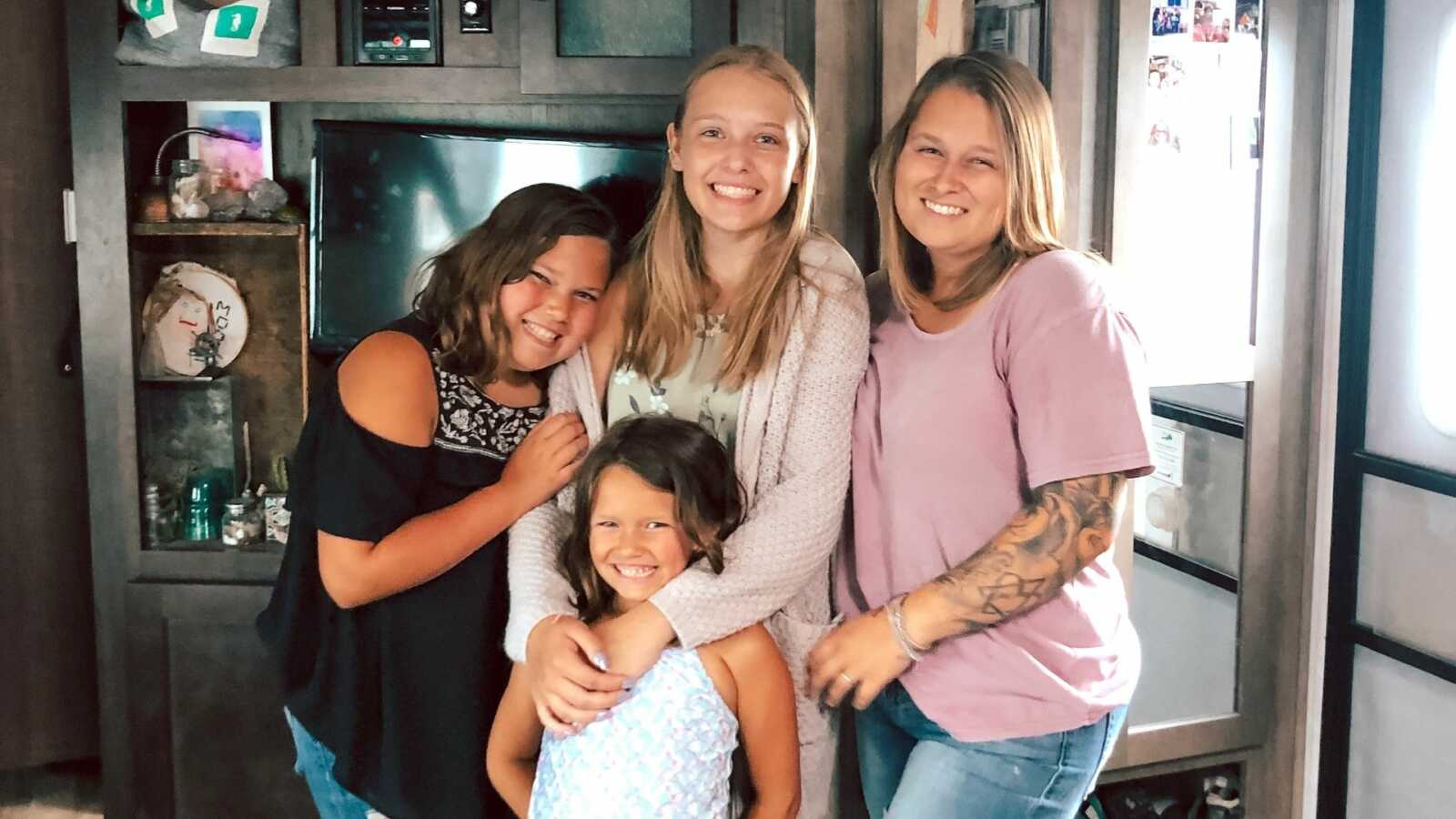 Woman with bio daughters and adopted half-sister