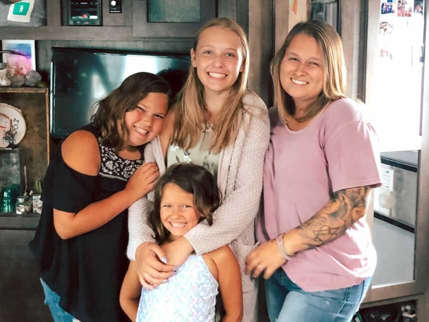 Woman with bio daughters and adopted half-sister